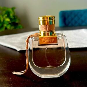 Chloe Nomade For Women Eau De Parfum Spray 1.0 Ounce, clear. 50 ml perfume